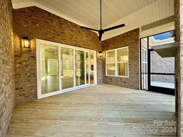 3850 Willow Grove Ln Unit 24, Concord, NC 28025 - unfurnished sunroom featuring hardwood / wood-style floors, plenty of natural light, brick wall, a deck, and wooden ceiling