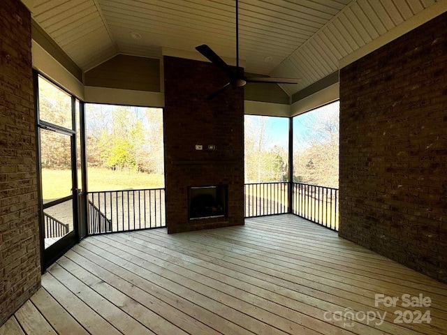 3850 Willow Grove Ln Unit 24, Concord, NC 28025 - unfurnished sunroom with lofted ceiling, ceiling fan, plenty of natural light, and an outdoor brick fireplace