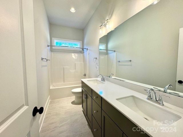 full bathroom featuring shower / washtub combination, vanity, and toilet