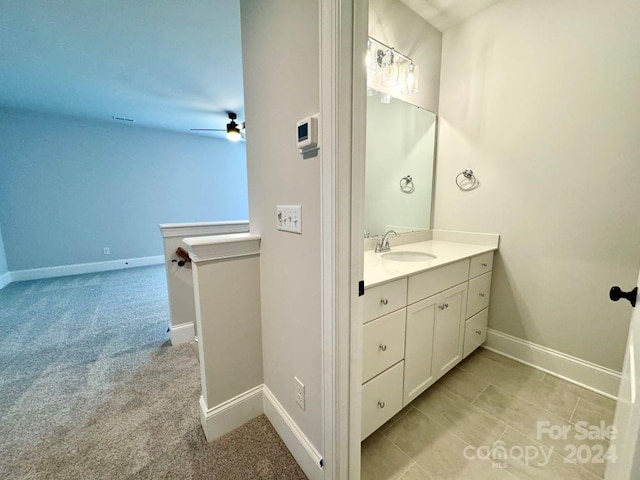3850 Willow Grove Ln Unit 24, Concord, NC 28025 - bathroom with vanity, baseboards, and ceiling fan