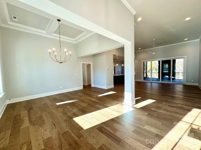 3850 Willow Grove Ln Unit 24, Concord, NC 28025 - unfurnished living room with crown molding, a chandelier, wood finished floors, recessed lighting, and a towering ceiling