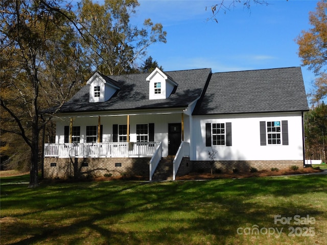 cape cod house with covered porch and a front yard