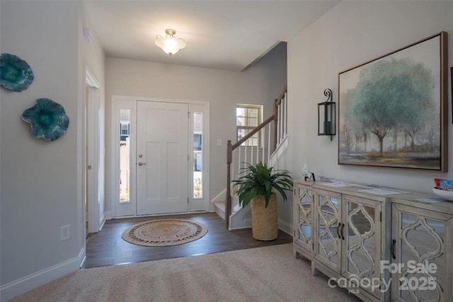 foyer entrance featuring dark hardwood / wood-style flooring