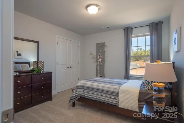 bedroom with light carpet