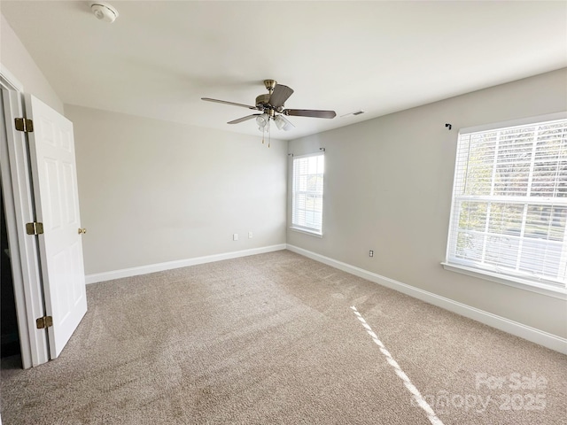 empty room with carpet floors and ceiling fan