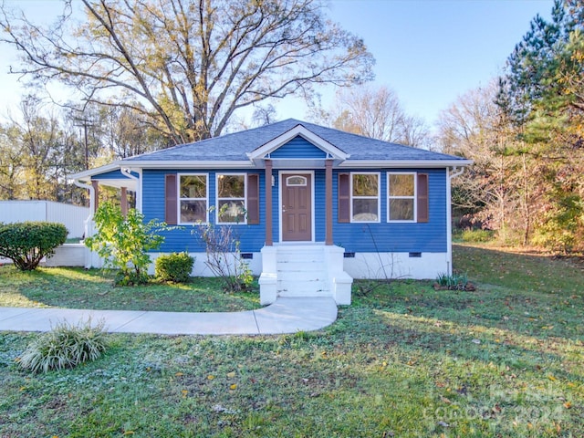 bungalow-style home with a front lawn