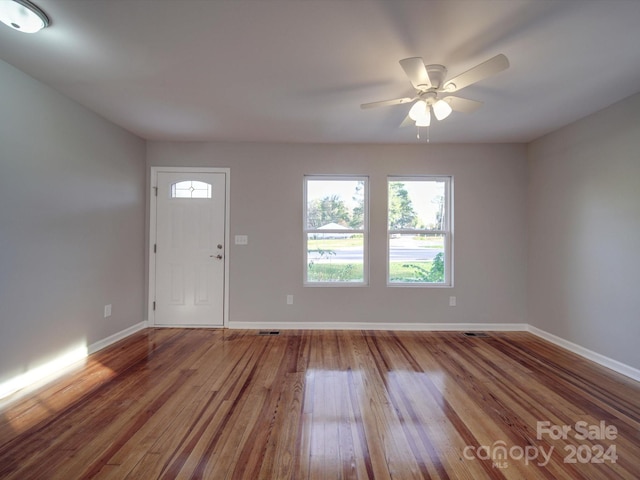 entrance foyer with ceiling fan and wood-type flooring