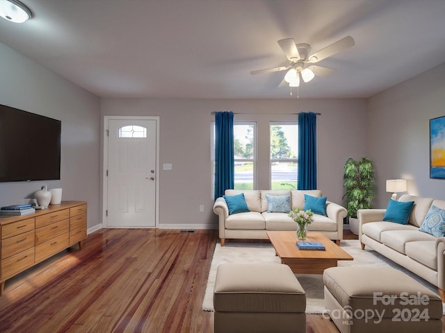 living room featuring ceiling fan and dark hardwood / wood-style flooring