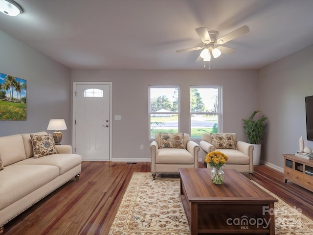 living room with ceiling fan and hardwood / wood-style floors