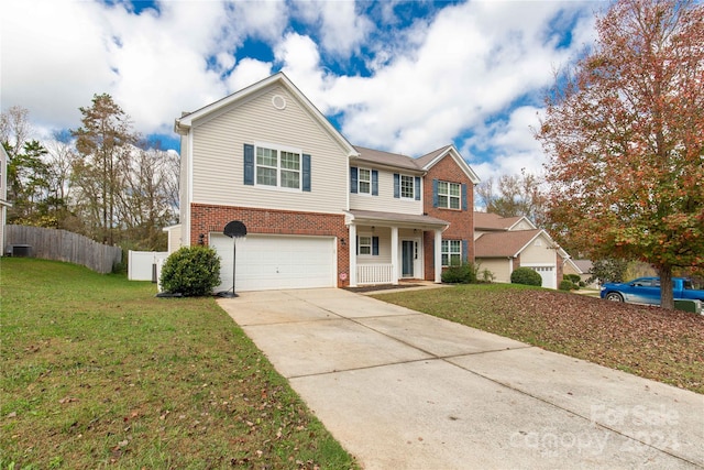 view of front of home with central AC, a garage, and a front lawn