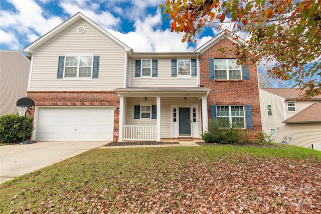 view of front facade with a front yard and a garage