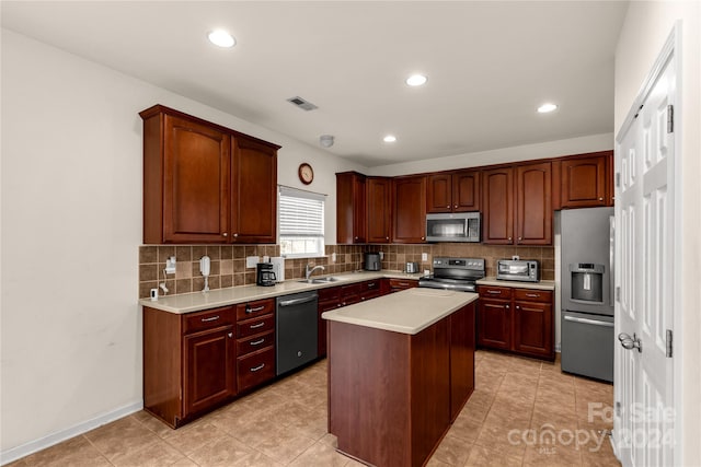 kitchen featuring sink, decorative backsplash, light tile patterned floors, appliances with stainless steel finishes, and a kitchen island