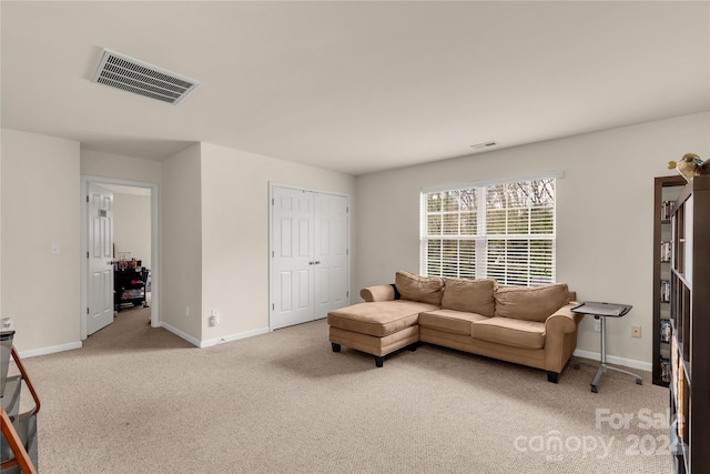 living room featuring light colored carpet