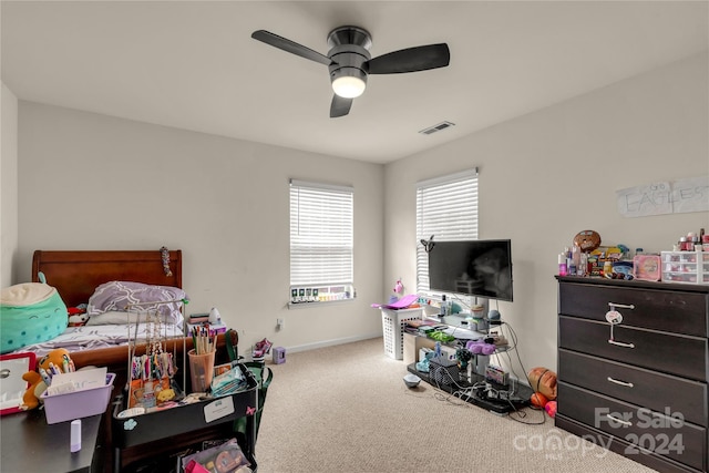 carpeted bedroom featuring ceiling fan