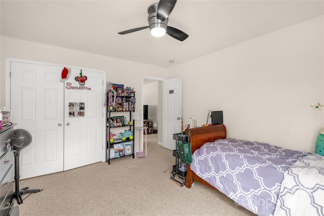 carpeted bedroom with a closet and ceiling fan