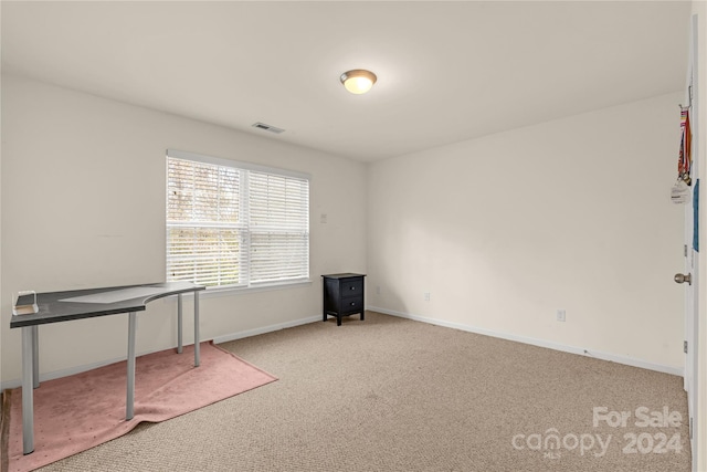 interior space featuring light colored carpet