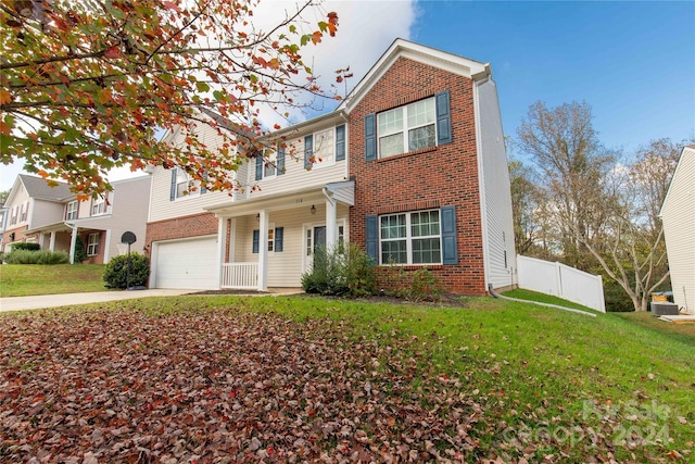 view of front of property with cooling unit, a front lawn, covered porch, and a garage