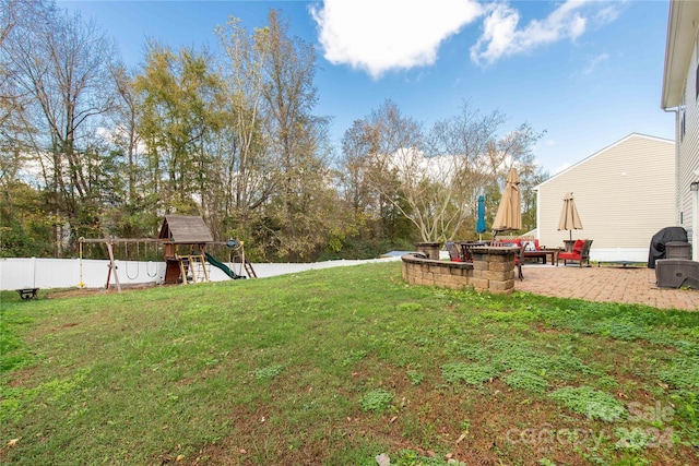 view of yard featuring a patio area and a playground