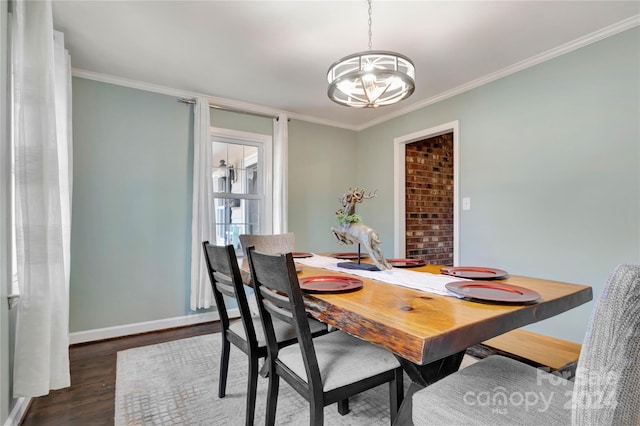 dining room featuring dark hardwood / wood-style floors and ornamental molding