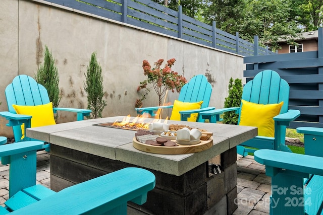 view of patio / terrace featuring a fire pit