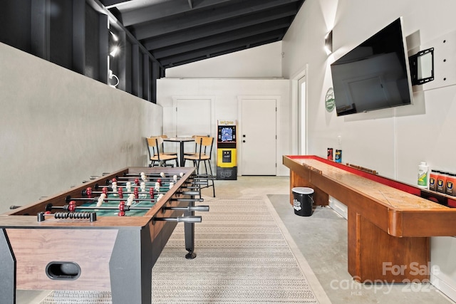 playroom featuring high vaulted ceiling