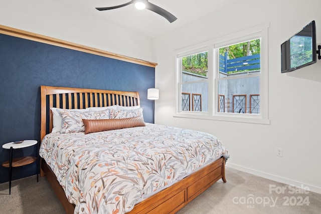 carpeted bedroom featuring ceiling fan