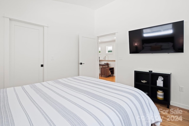 bedroom featuring hardwood / wood-style flooring