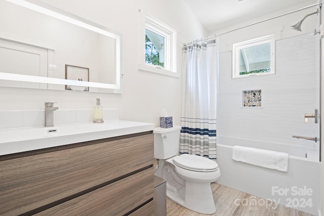 full bathroom featuring shower / bath combination with curtain, vanity, wood-type flooring, toilet, and lofted ceiling