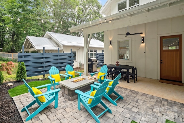 view of patio / terrace featuring area for grilling, an outdoor fire pit, and ceiling fan