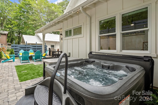 view of patio with a hot tub