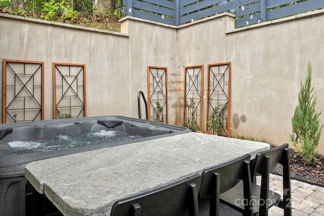 view of patio featuring a hot tub