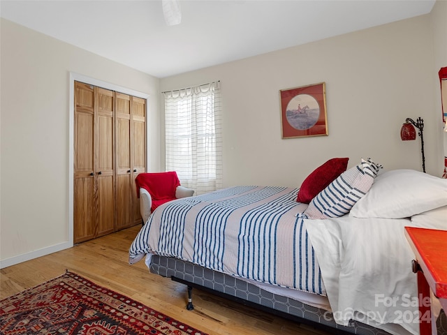 bedroom featuring a closet and hardwood / wood-style floors