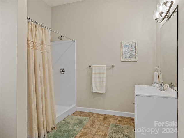 bathroom featuring vanity and walk in shower