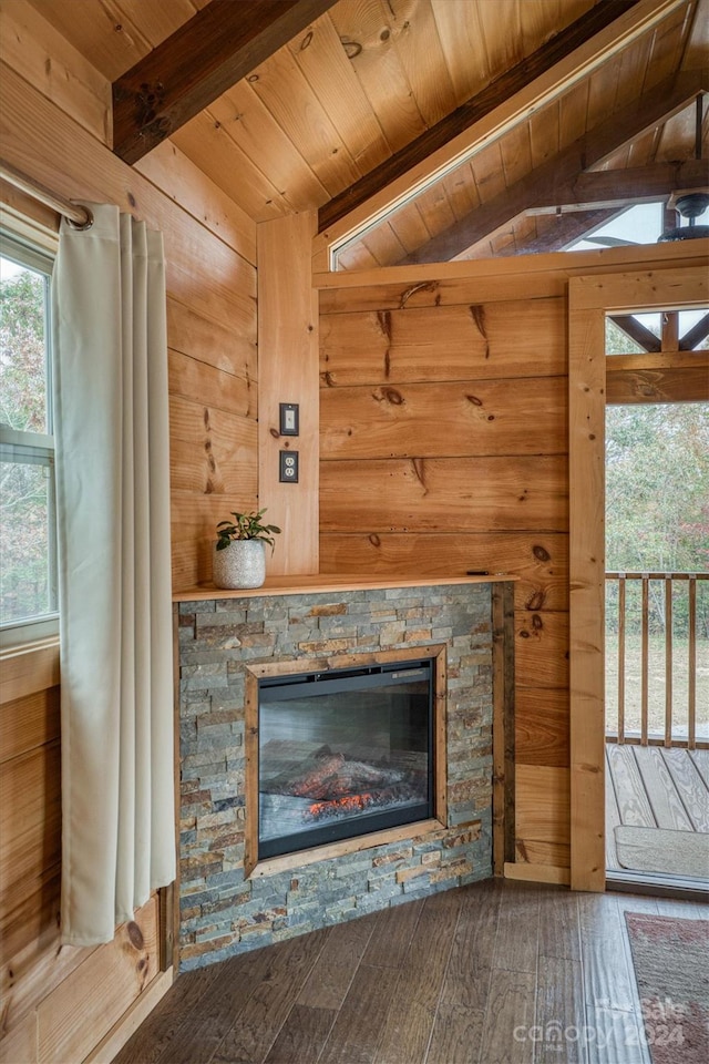 details with wooden walls, a fireplace, beamed ceiling, wood-type flooring, and wood ceiling