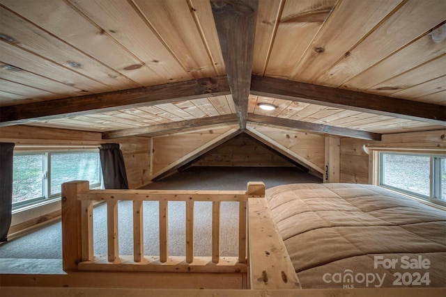 unfurnished bedroom with lofted ceiling with beams and wood ceiling