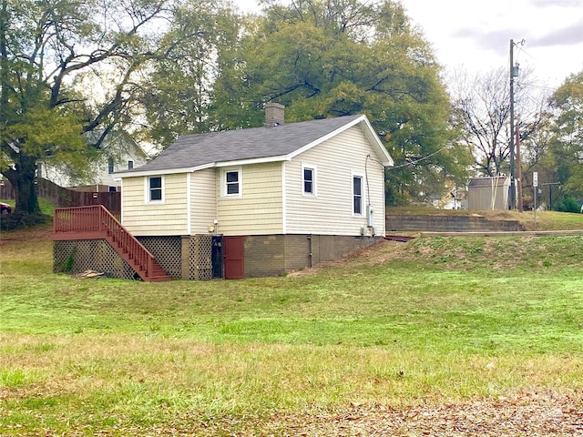 view of property exterior with a lawn and a deck