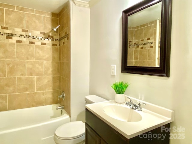 bathroom featuring toilet, bathing tub / shower combination, and vanity