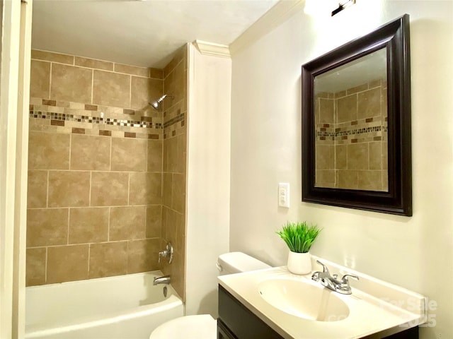 bathroom featuring washtub / shower combination, vanity, and toilet