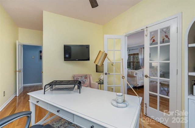 office featuring ceiling fan, french doors, and light hardwood / wood-style floors