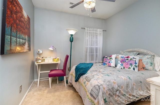 bedroom featuring ceiling fan and light colored carpet