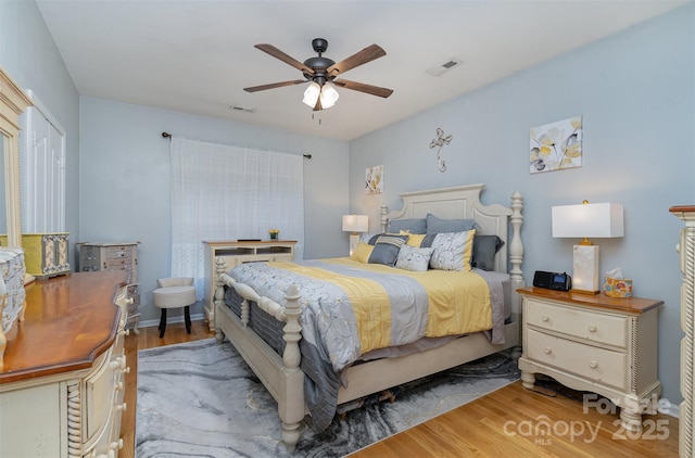 bedroom with ceiling fan and light wood-type flooring