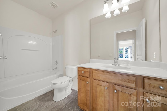 full bathroom featuring bathing tub / shower combination, tile patterned flooring, vanity, and toilet