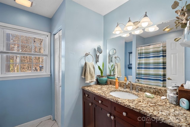 bathroom with tile patterned floors and vanity