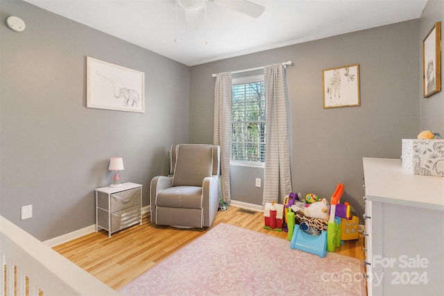 rec room with ceiling fan and wood-type flooring