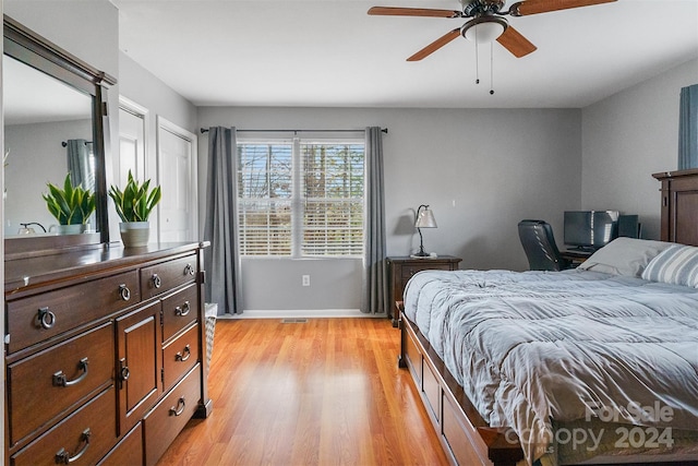 bedroom featuring ceiling fan and light hardwood / wood-style flooring