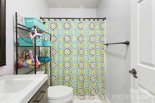 bathroom with vanity and toilet