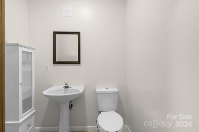 bathroom with toilet and sink