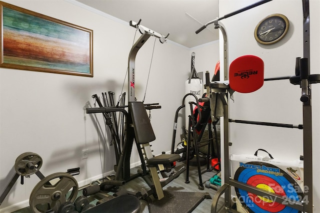 workout room with ornamental molding