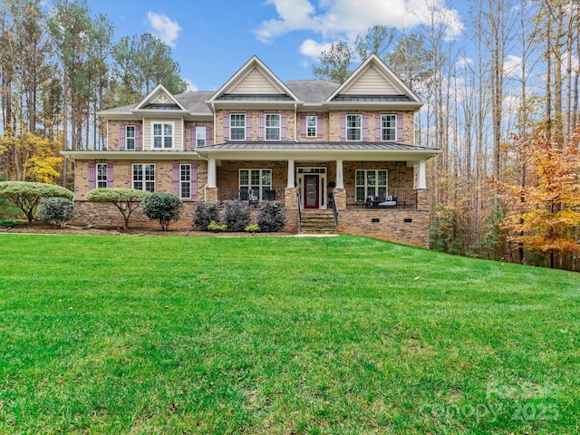 view of front of house featuring covered porch and a front yard