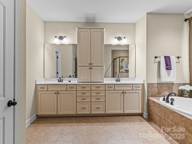 bathroom featuring shower with separate bathtub, tile patterned floors, and vanity